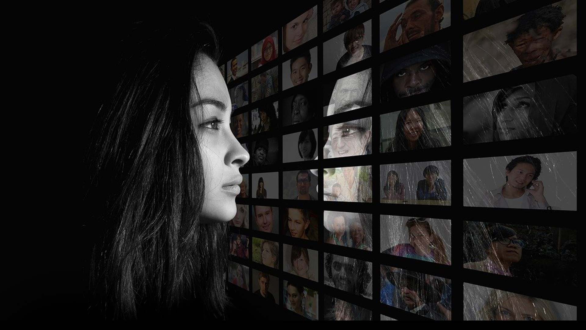 Woman looking at screen with people from different backgrounds